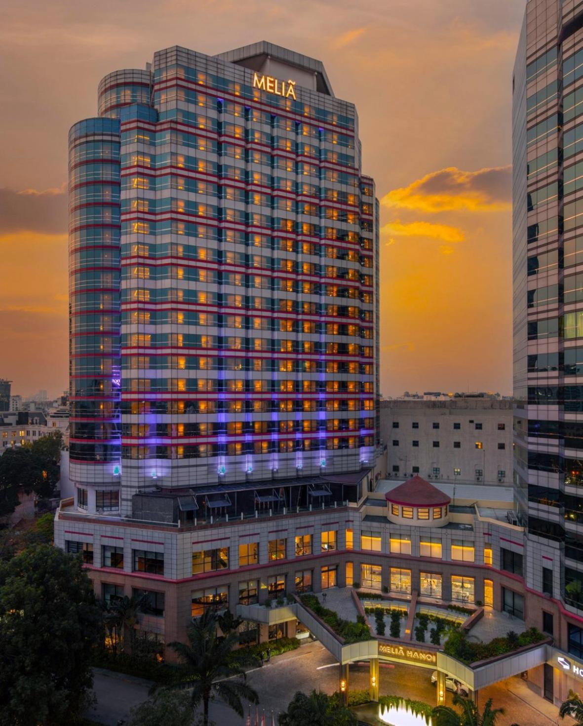 Melia Hanoi Exterior photo The hotel at sunset