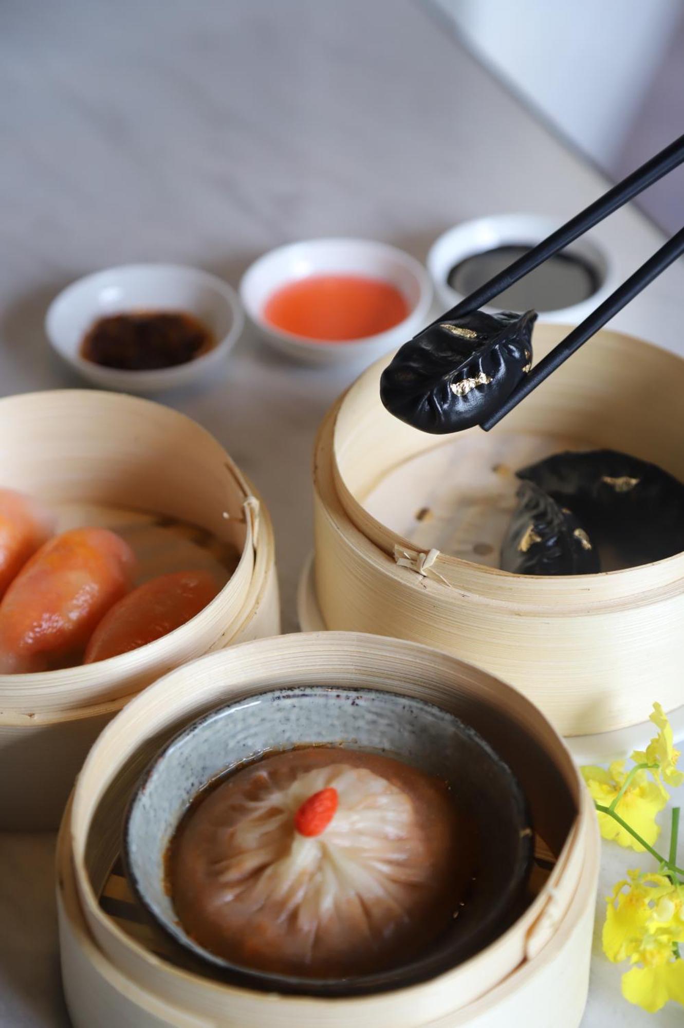 Melia Hanoi Exterior photo Soy sauce being used with dim sum