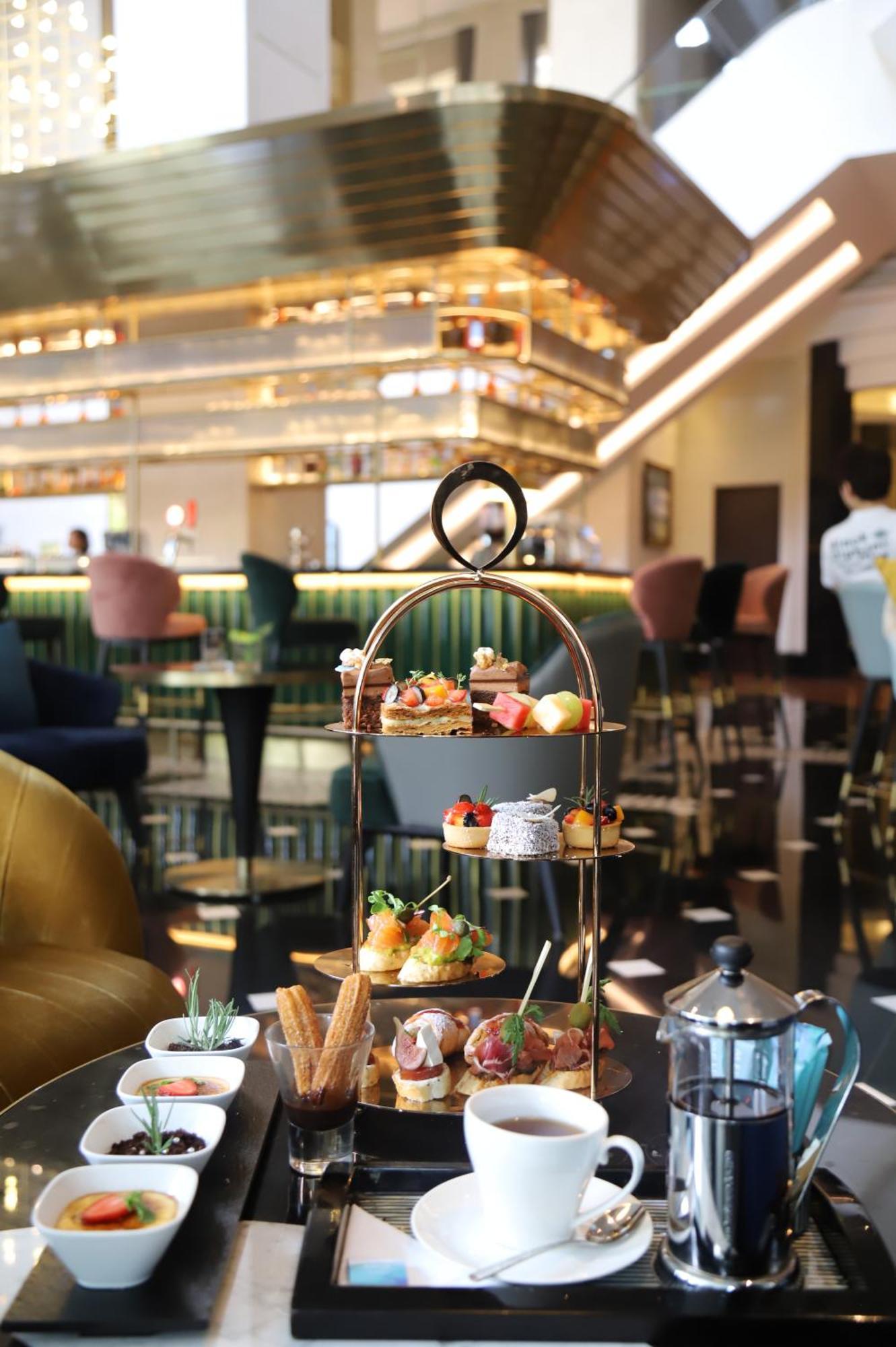 Melia Hanoi Exterior photo Afternoon tea at the lounge